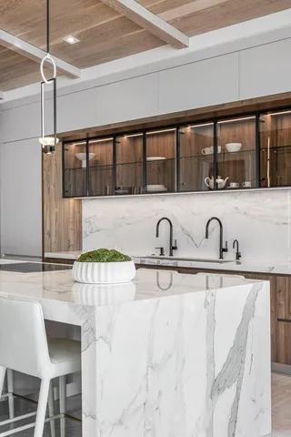 a view of a house with a yard and a pond