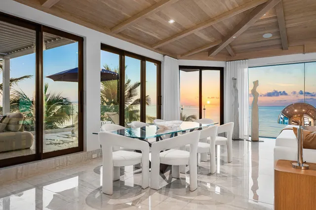 a room with lots of furniture and windows