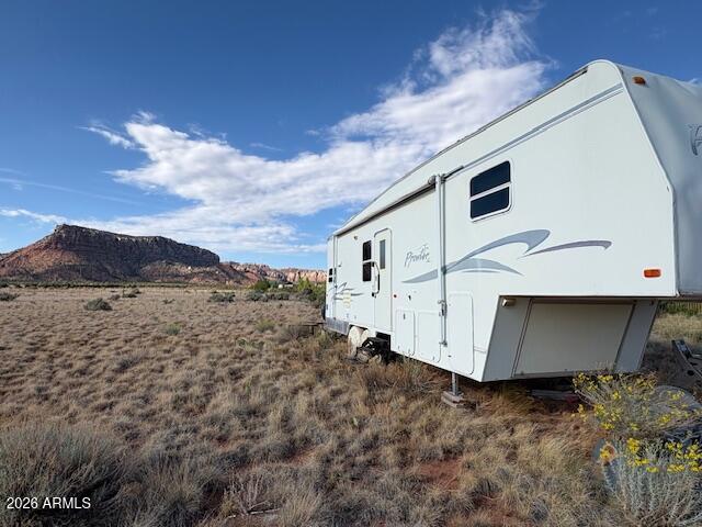 0 South School Bound Road, Unit LOT 2 Colorado City, AZ 86021 - Photo 11 of 13 a view of a house with a backyard