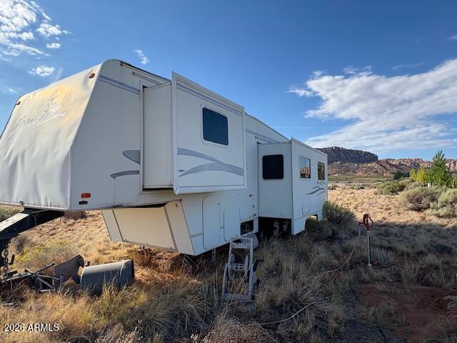 0 South School Bound Road, Unit LOT 2 Colorado City, AZ 86021 - Photo 9 of 13 a view of a house with a yard