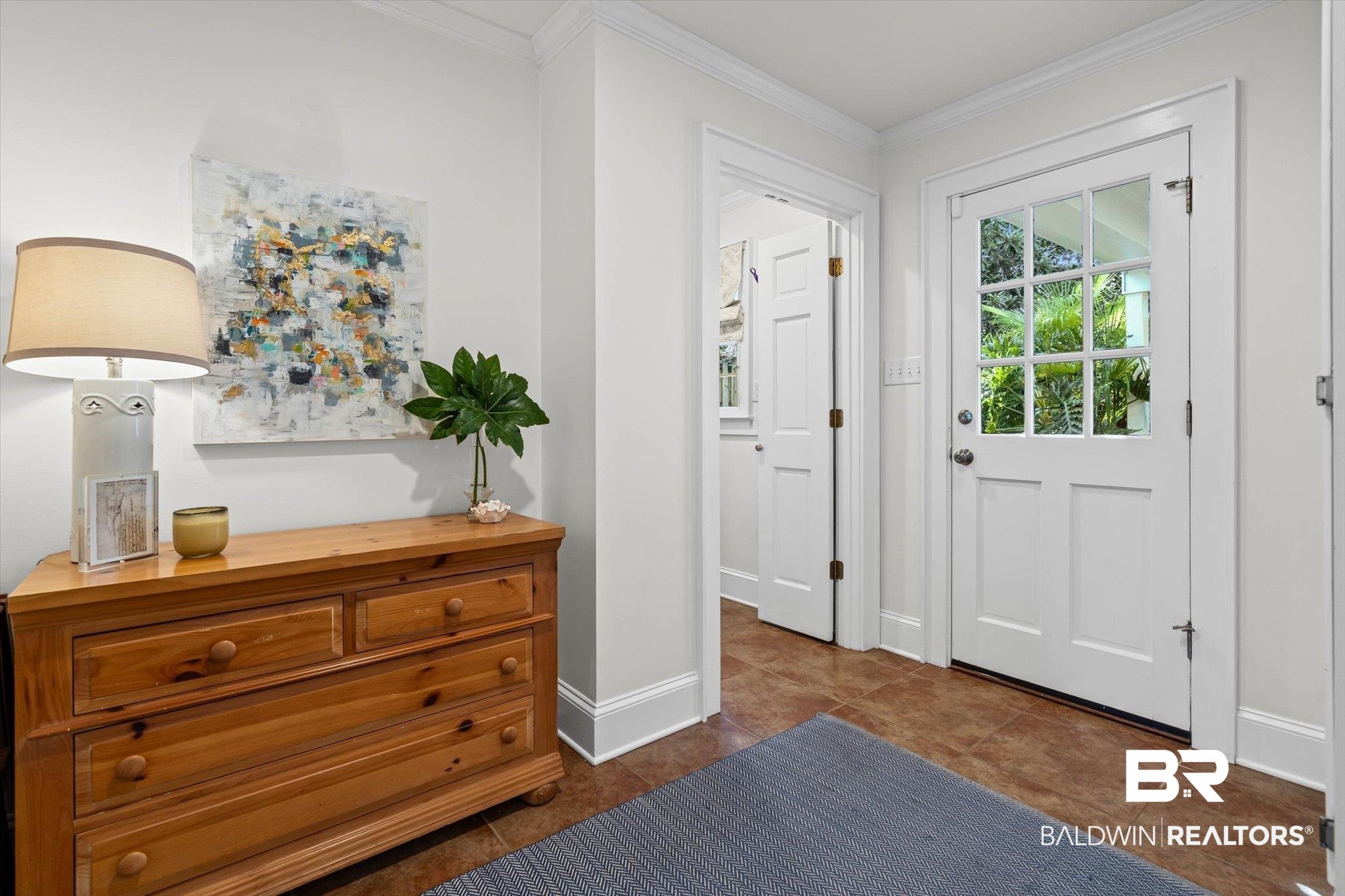 513 Spring Park Drive East Mobile, AL 36608 - Photo 15 of 44 Entryway featuring crown molding and tile patterned floors