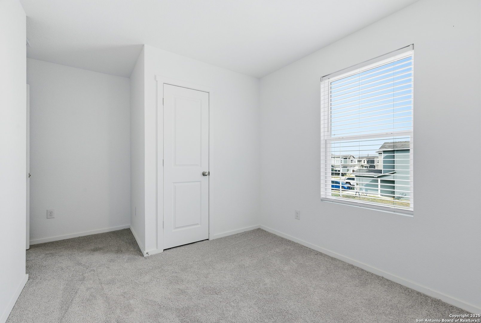 11814 Bluebell Ridge Converse, TX 78109 - Photo 17 of 20 a view of an empty room with a window