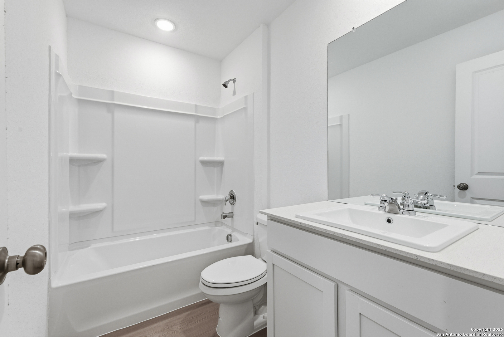 11814 Bluebell Ridge Converse, TX 78109 - Photo 18 of 20 a bathroom with a sink a toilet and shower