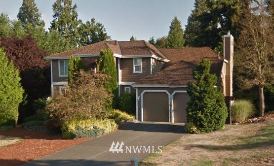 15502 Southeast 133rd Street Renton, WA 98059 - Photo 1 of 1 a front view of a house with a garden