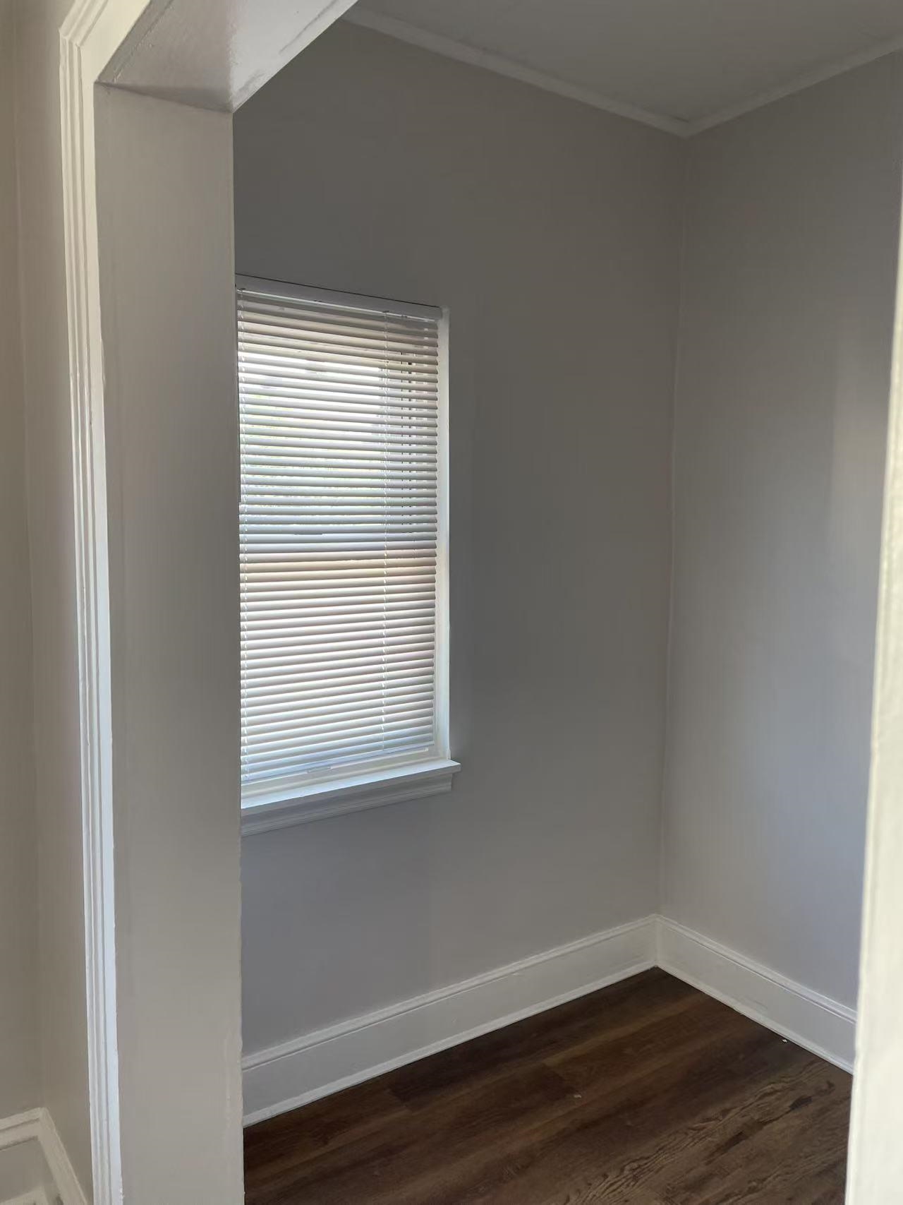 109 70th Street, Unit 2 Guttenberg, NJ 07093 - Photo 17 of 17 a view of an empty room with wooden floor and a window