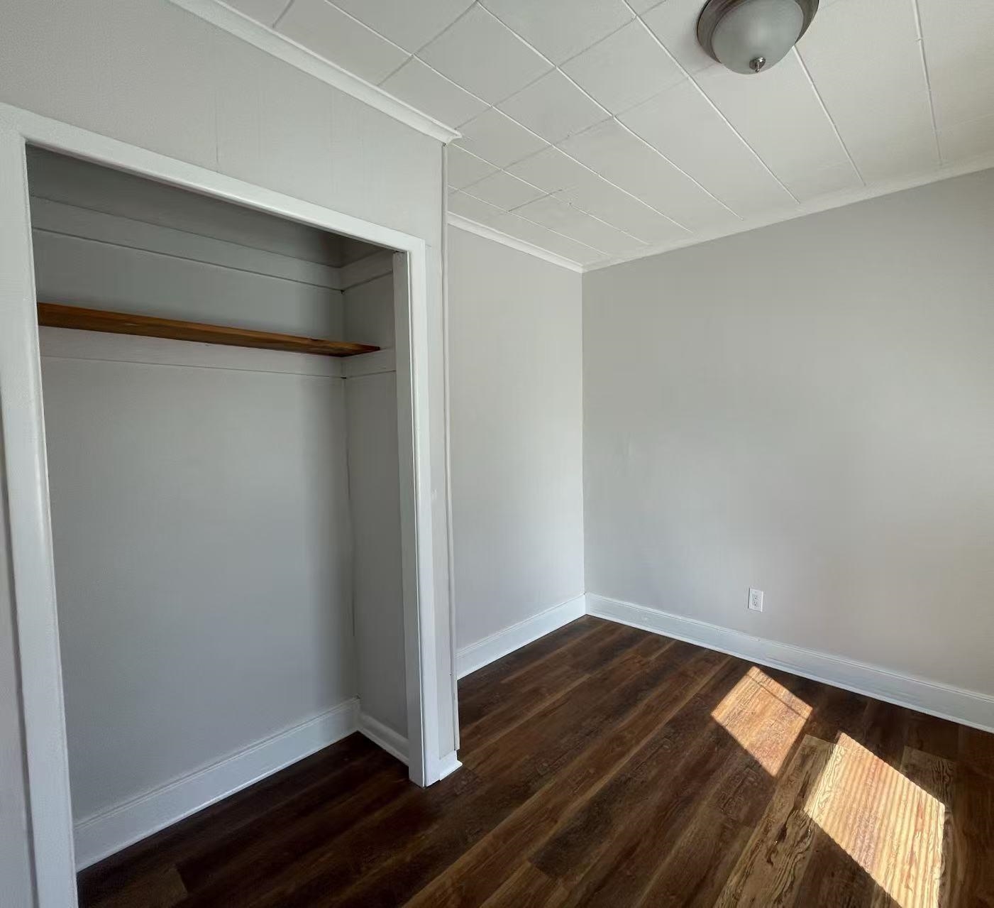 109 70th Street, Unit 2 Guttenberg, NJ 07093 - Photo 6 of 17 wooden floor in an empty room