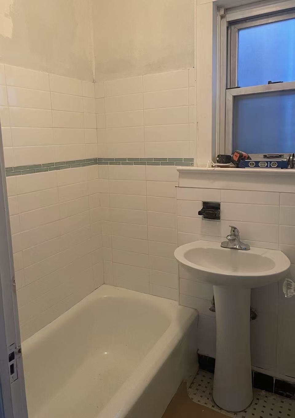109 70th Street, Unit 2 Guttenberg, NJ 07093 - Photo 10 of 17 a bathroom with a sink and a bathtub