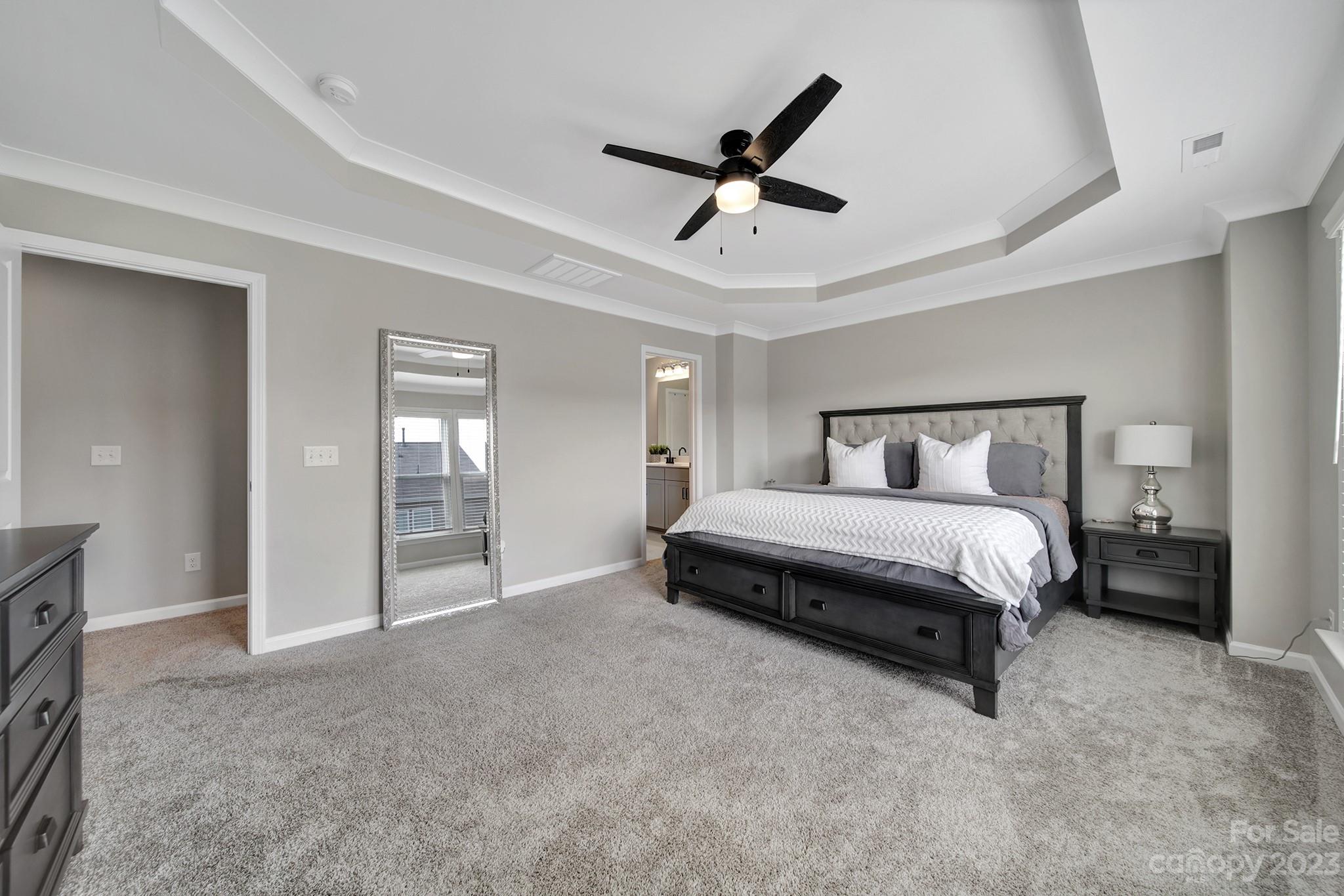 816 Canoe Song Road Fort Mill, SC 29708 - Photo 11 of 24 a bedroom with a large bed and window