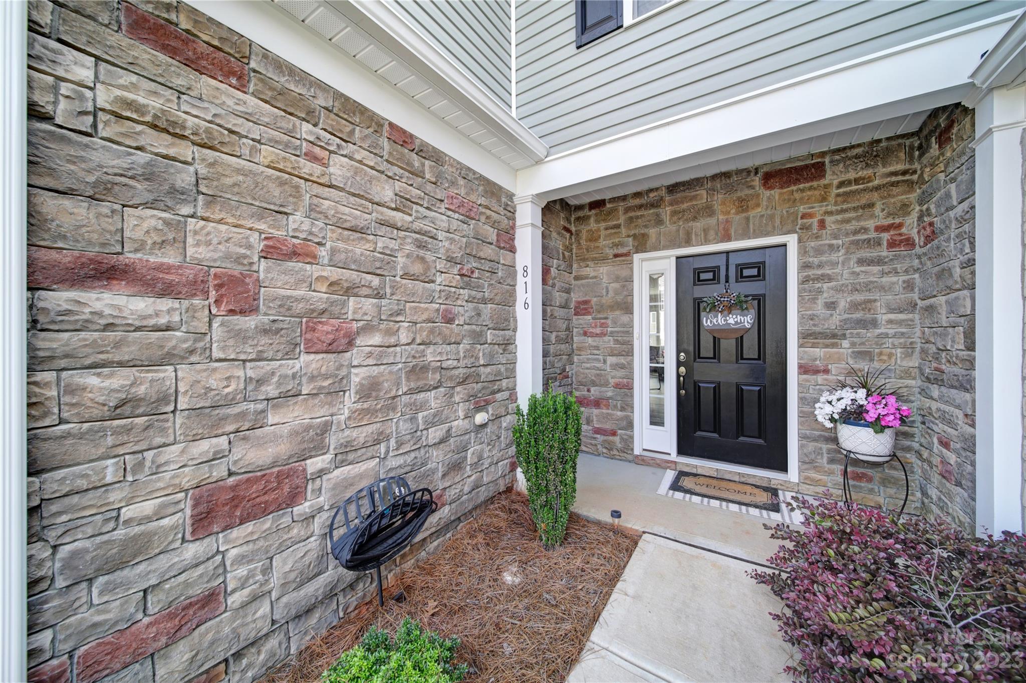 816 Canoe Song Road Fort Mill, SC 29708 - Photo 2 of 24 a front view of a house with a garden