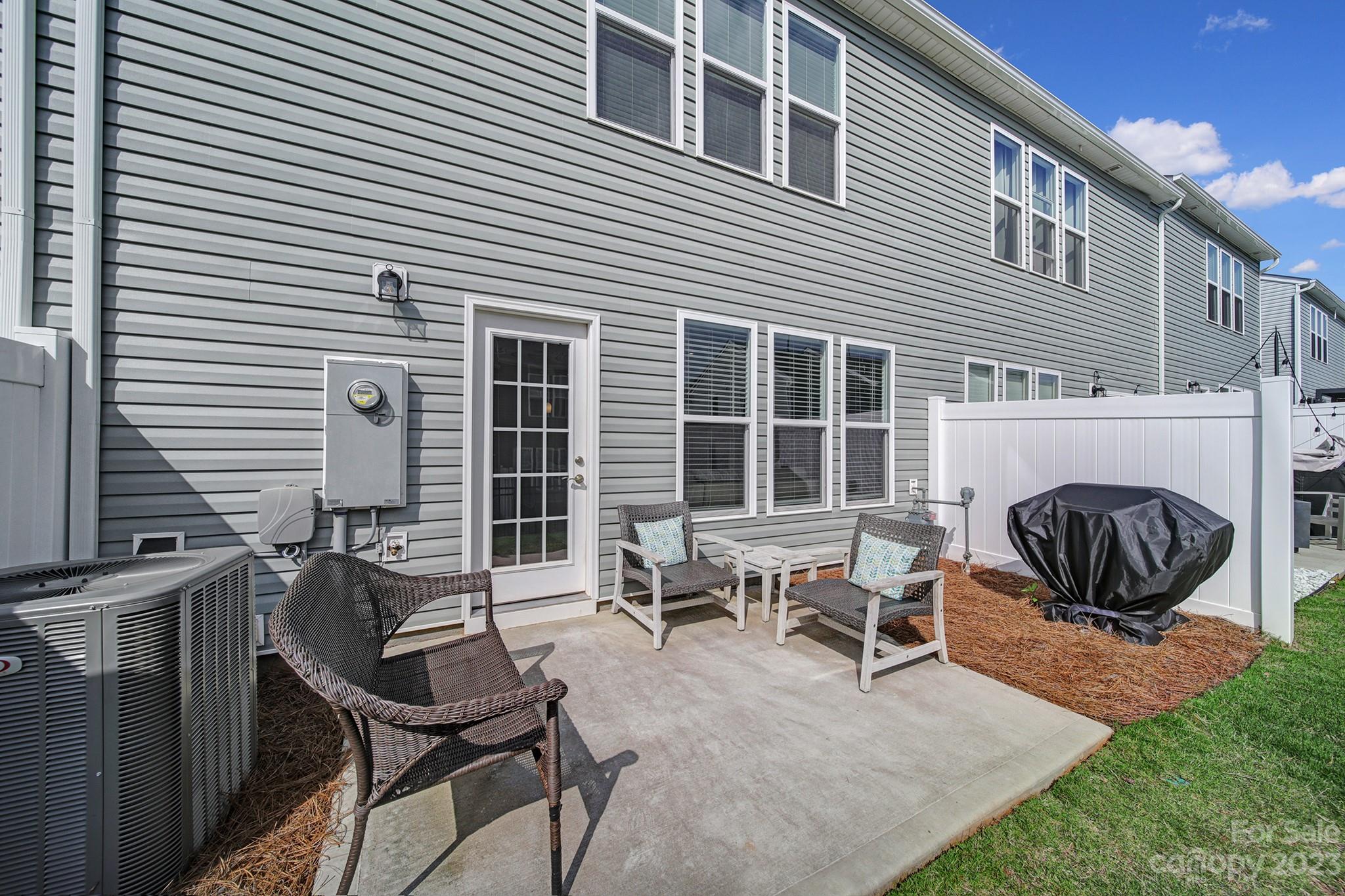 816 Canoe Song Road Fort Mill, SC 29708 - Photo 22 of 24 a view of a house with backyard and sitting area