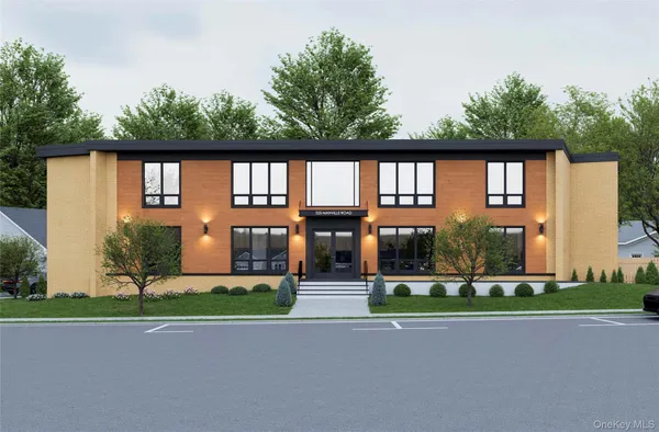 a front view of a house with a garden and plants