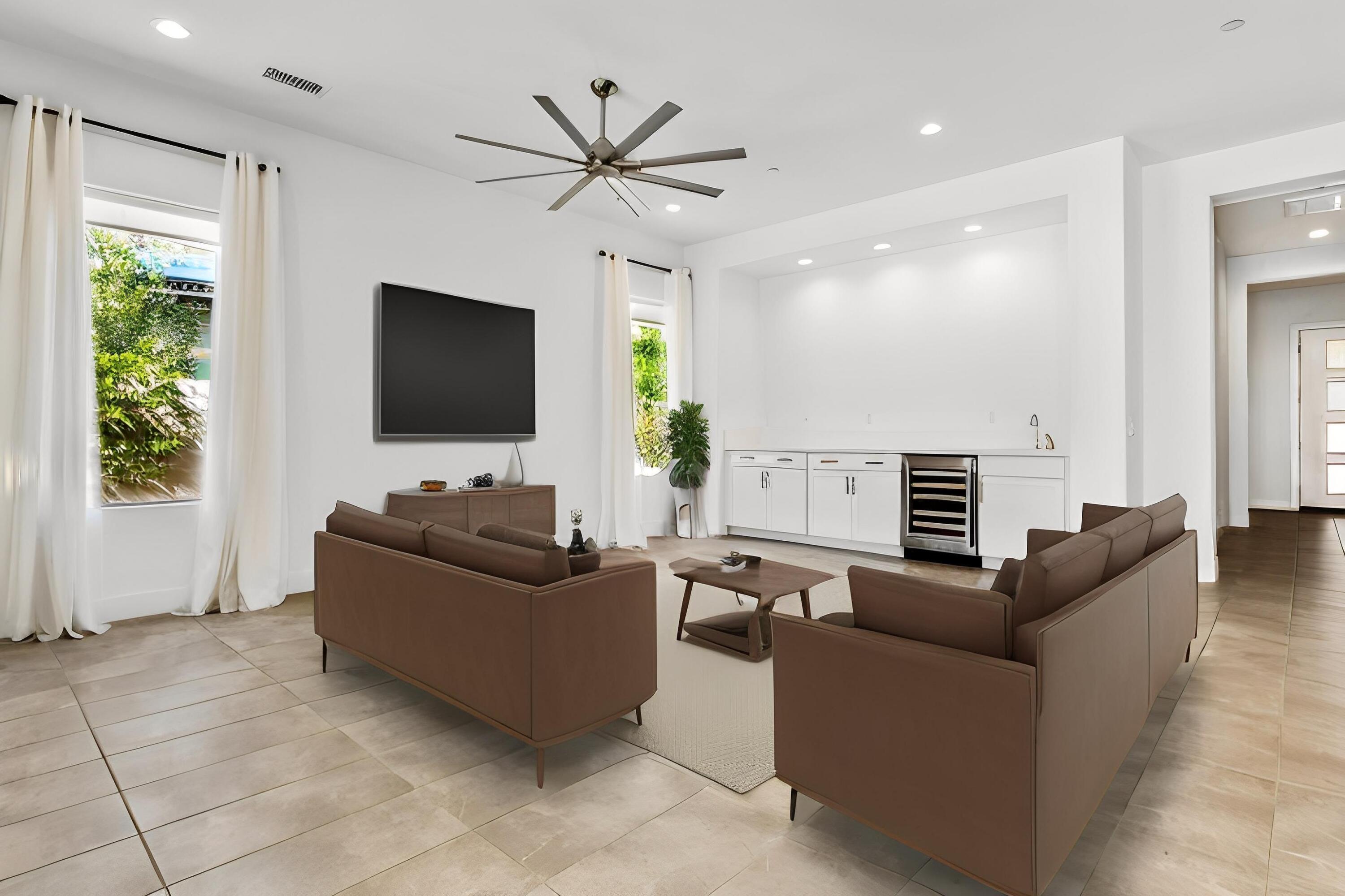 36 Burgundy Rancho Mirage, CA 92270 - Photo 4 of 14 a living room with furniture and a flat screen tv