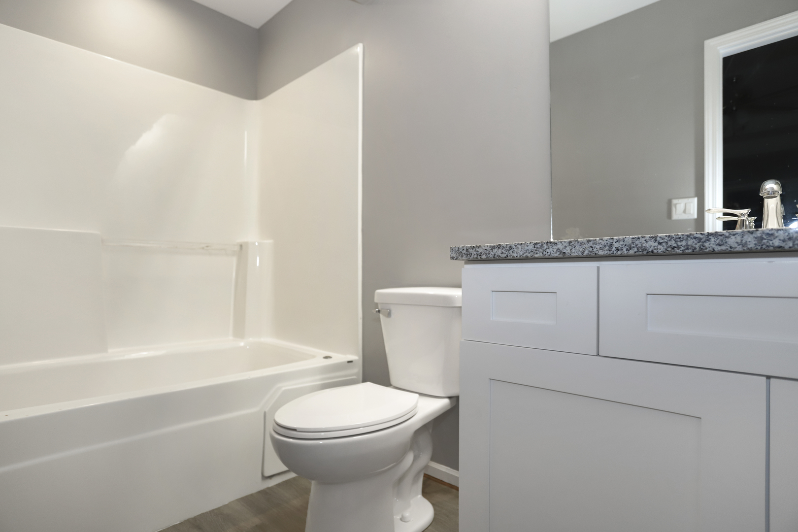 100 Ravinia Drive Shorewood, IL 60404 - Photo 21 of 33 a bathroom with a toilet a sink and bathtub