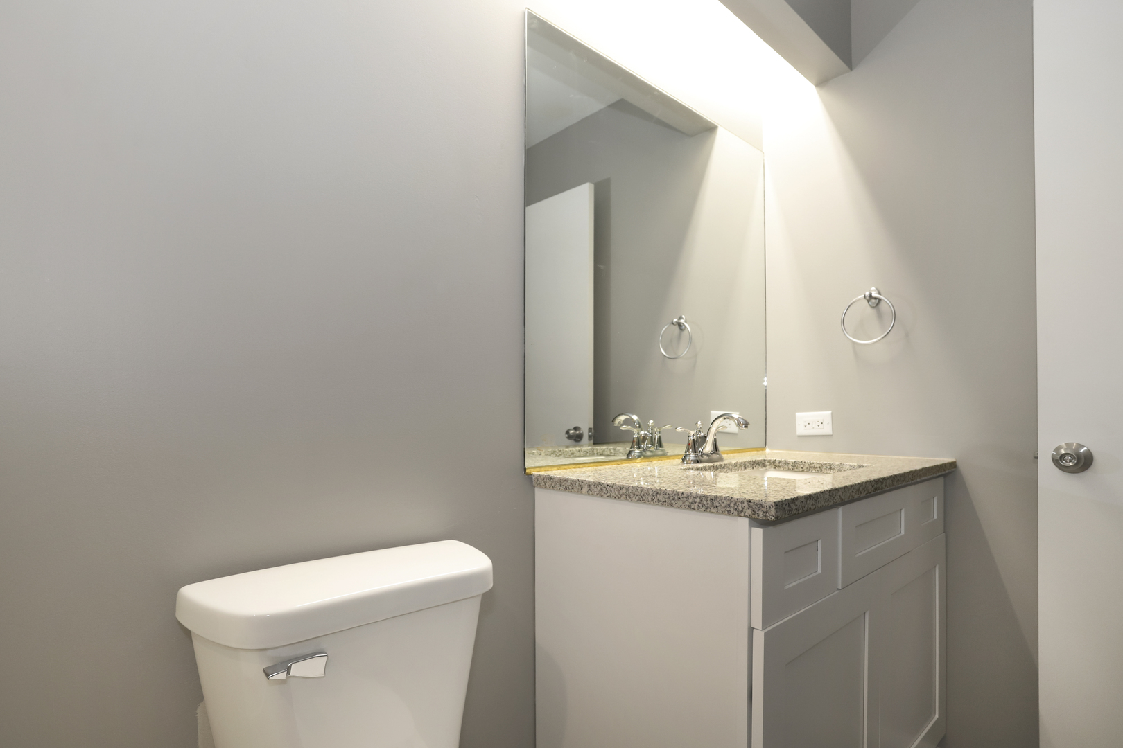100 Ravinia Drive Shorewood, IL 60404 - Photo 22 of 33 a bathroom with a toilet sink and mirror