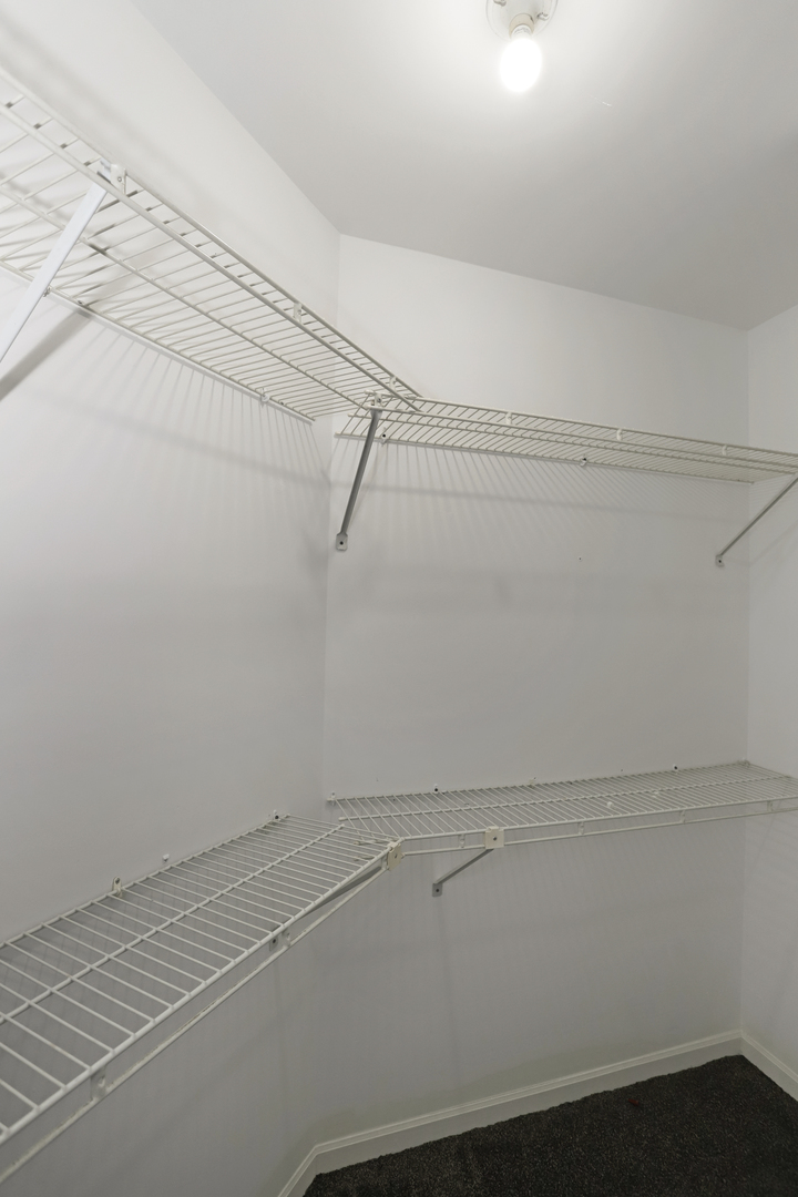 100 Ravinia Drive Shorewood, IL 60404 - Photo 23 of 33 a view of a room with racks on the wall