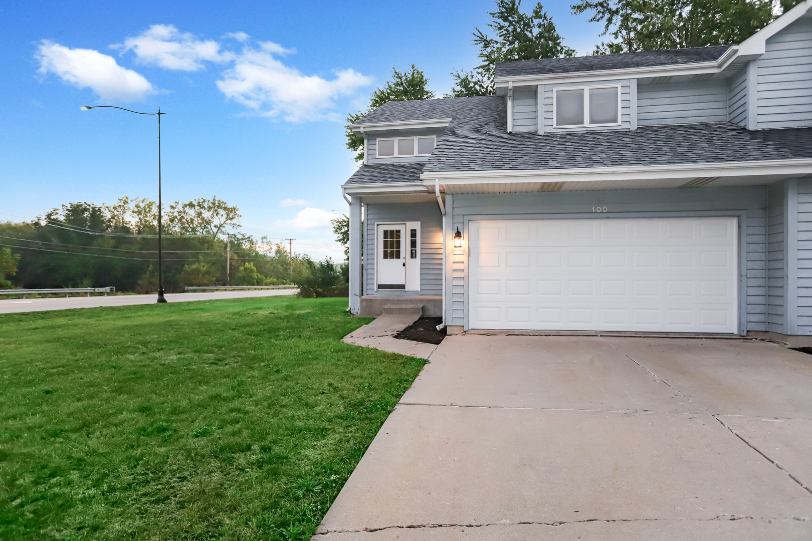 100 Ravinia Drive Shorewood, IL 60404 - Photo 5 of 33 a front view of a house with garden
