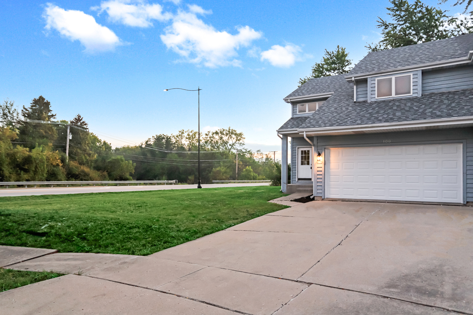 100 Ravinia Drive Shorewood, IL 60404 - Photo 6 of 33 a front view of a house with garden
