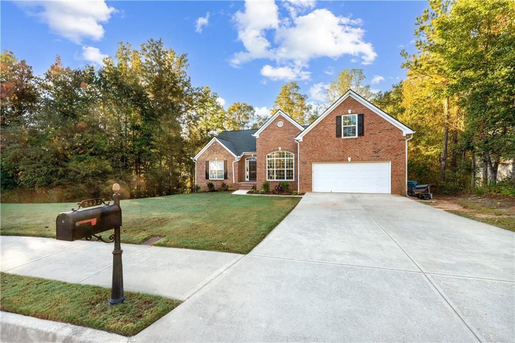 a front view of a house with a yard