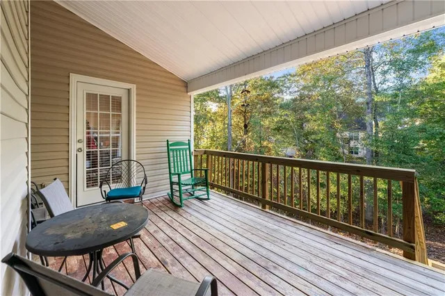 a view of a two chairs in the balcony