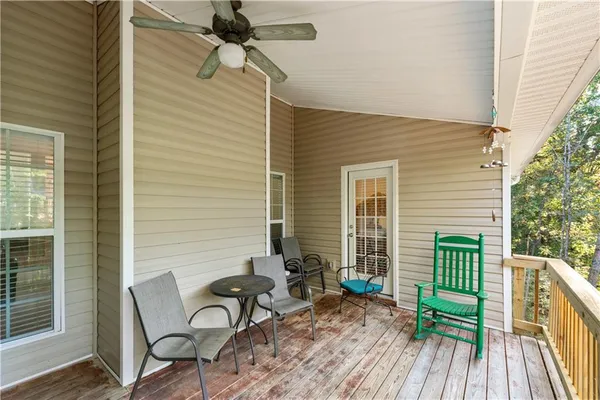 a view of a two chairs in the balcony
