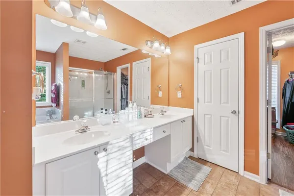 a bathroom with a double vanity sink mirror and double