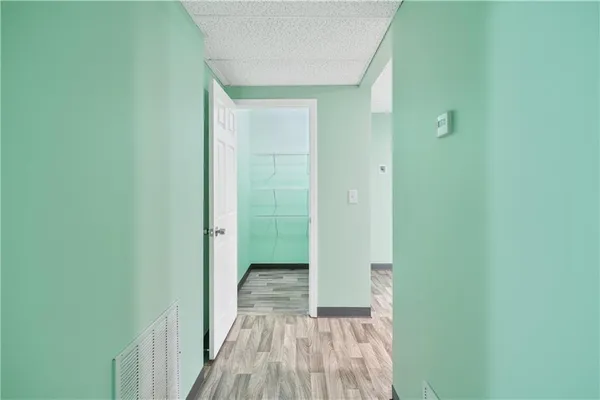 a view of a bathroom from a hallway