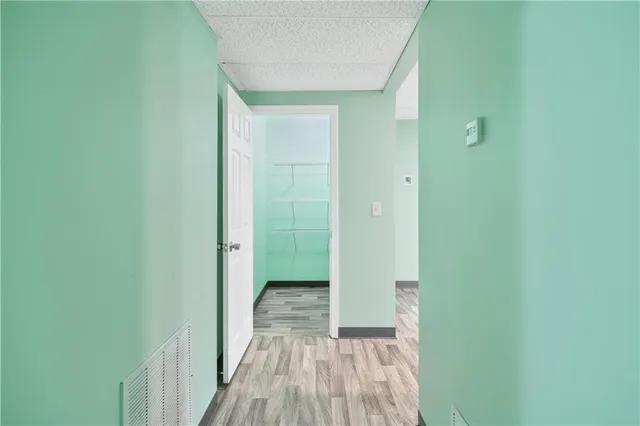 a view of a bathroom from a hallway