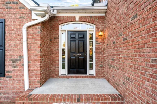 a view of a brick house with windows