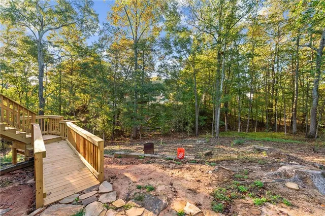 a backyard of a house with lots of green space