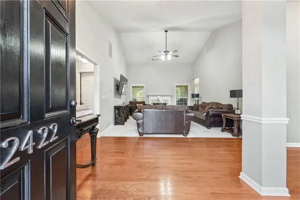 a living room with lots of furniture and a chandelier