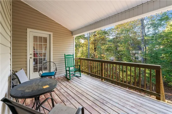 a view of a two chairs in the balcony