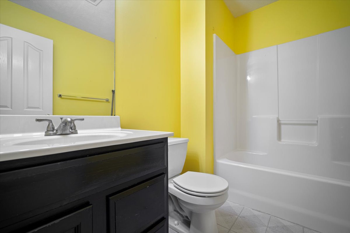 1704 Sunrise Point Normal, IL 61761 - Photo 21 of 33 a bathroom with a granite countertop sink toilet and shower