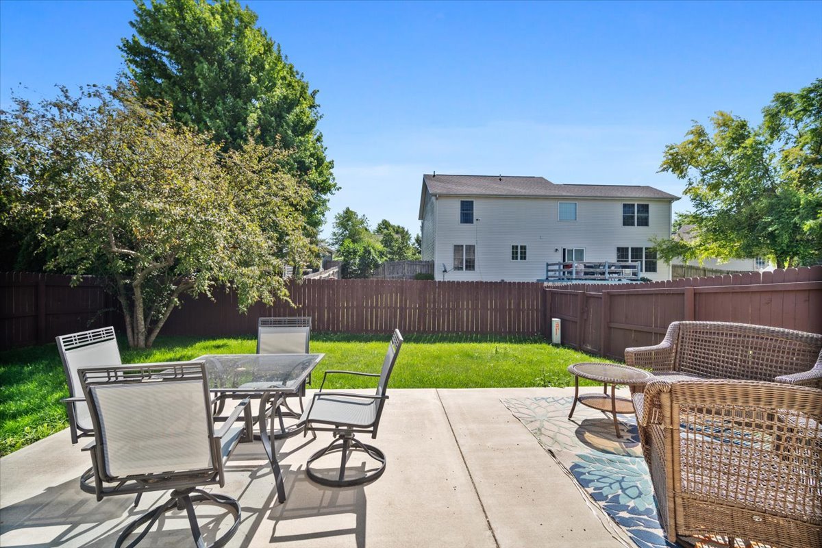 1704 Sunrise Point Normal, IL 61761 - Photo 30 of 33 a backyard of a house with table and chairs