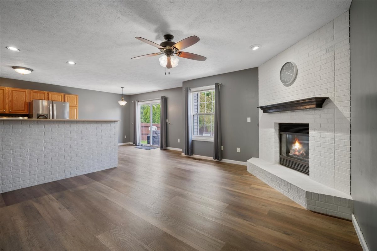 1704 Sunrise Point Normal, IL 61761 - Photo 4 of 33 a view of an empty room with a fireplace and a window