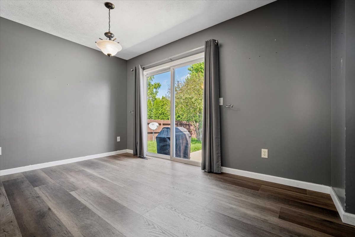 1704 Sunrise Point Normal, IL 61761 - Photo 7 of 33 a view of a room with a large window and wooden floor