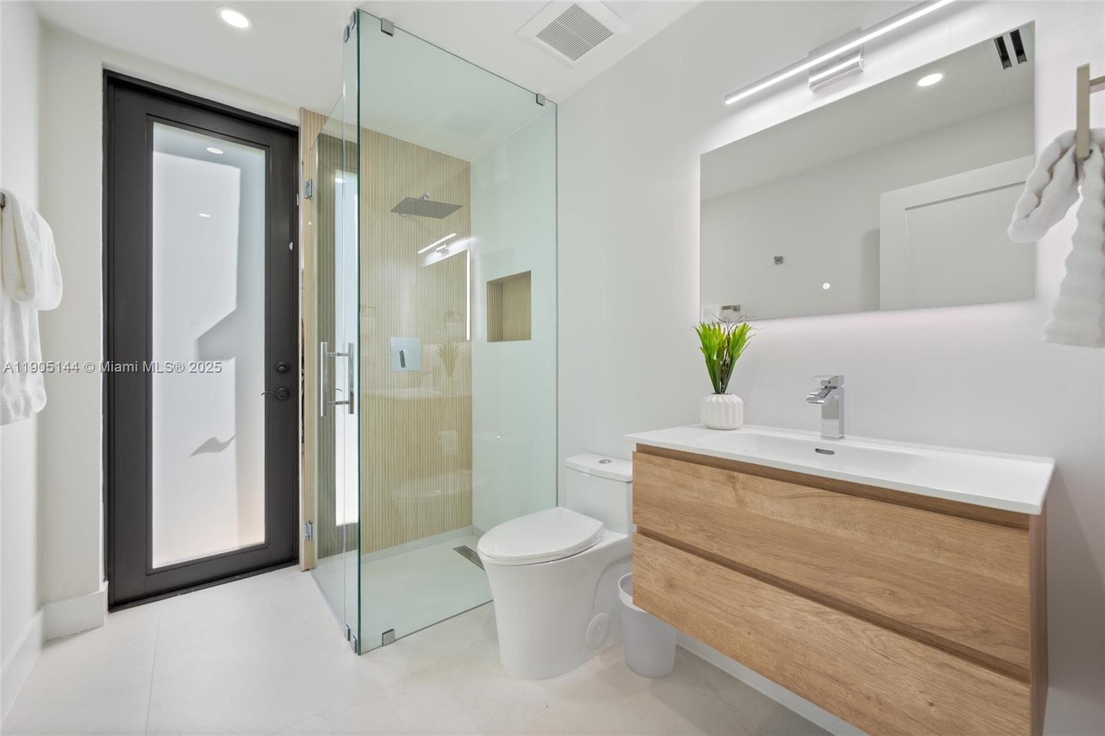 2127 Southwest 11th Terrace Miami, FL 33135 - Photo 18 of 28 a bathroom with a sink a toilet and shower