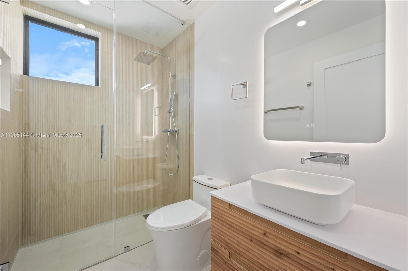 2127 Southwest 11th Terrace Miami, FL 33135 - Photo 25 of 28 a bathroom with a sink toilet and shower