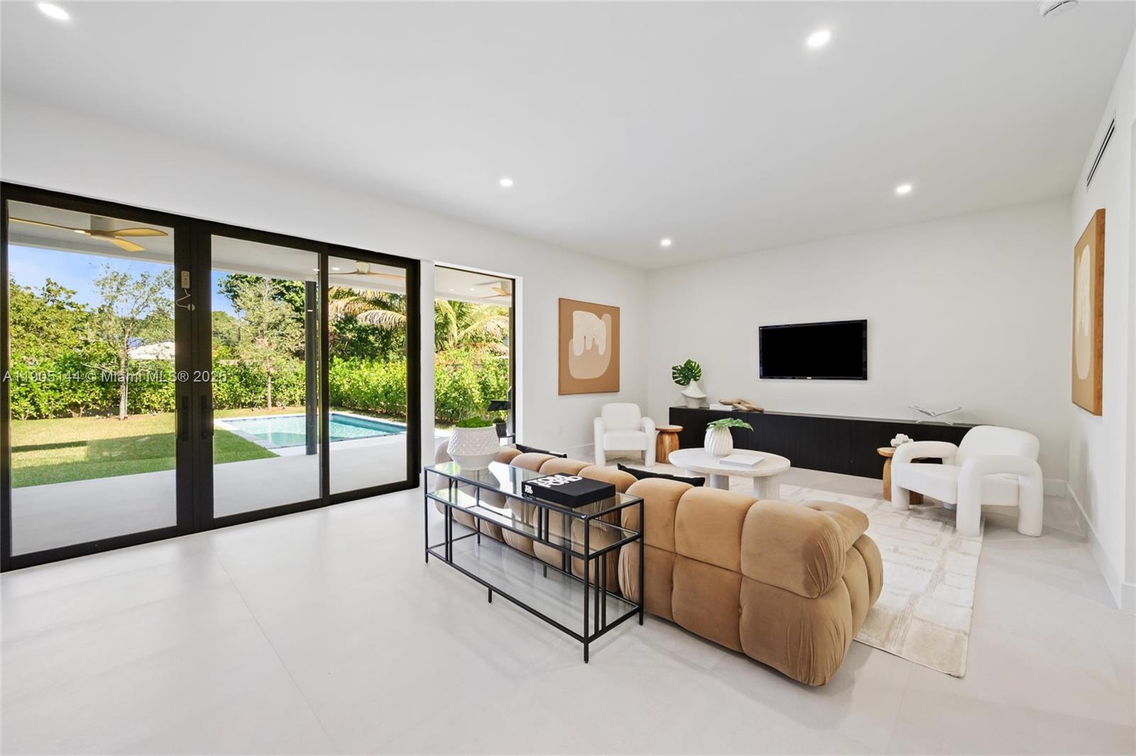 2127 Southwest 11th Terrace Miami, FL 33135 - Photo 3 of 28 a living room with furniture and large windows