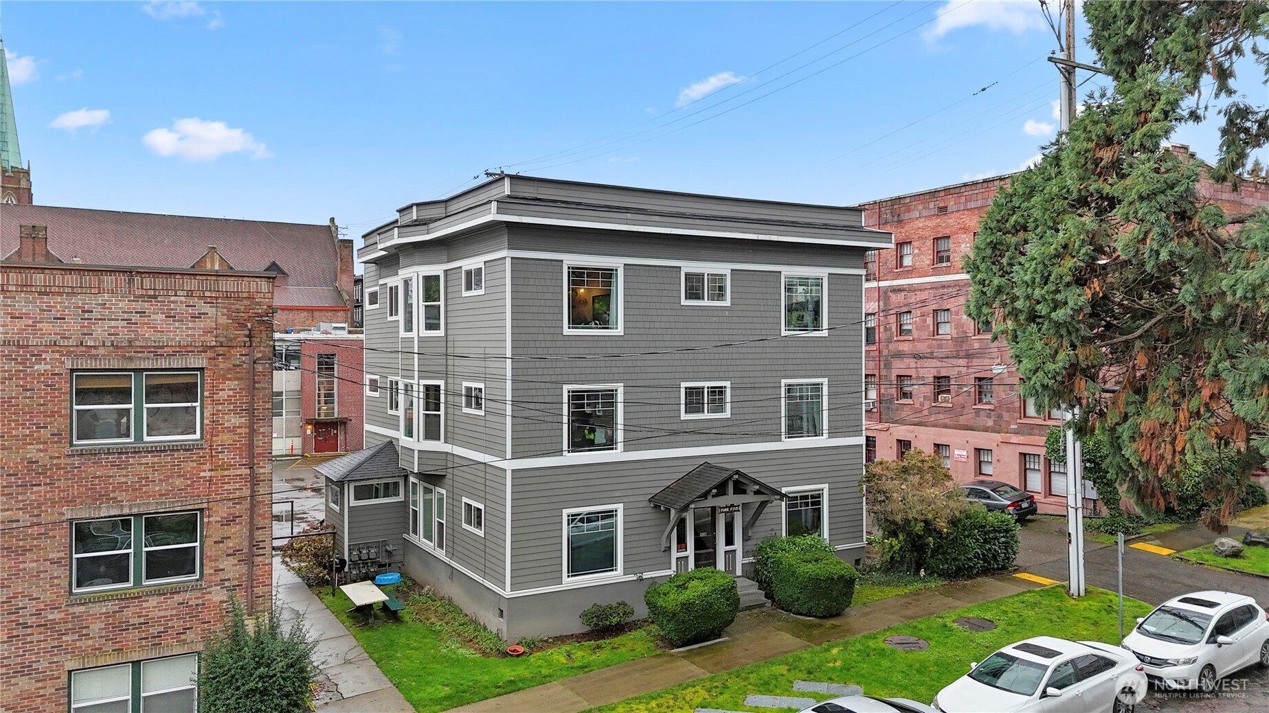 a front view of a house with garden