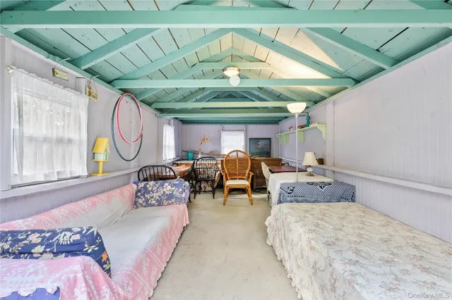 a bed room with bed and window