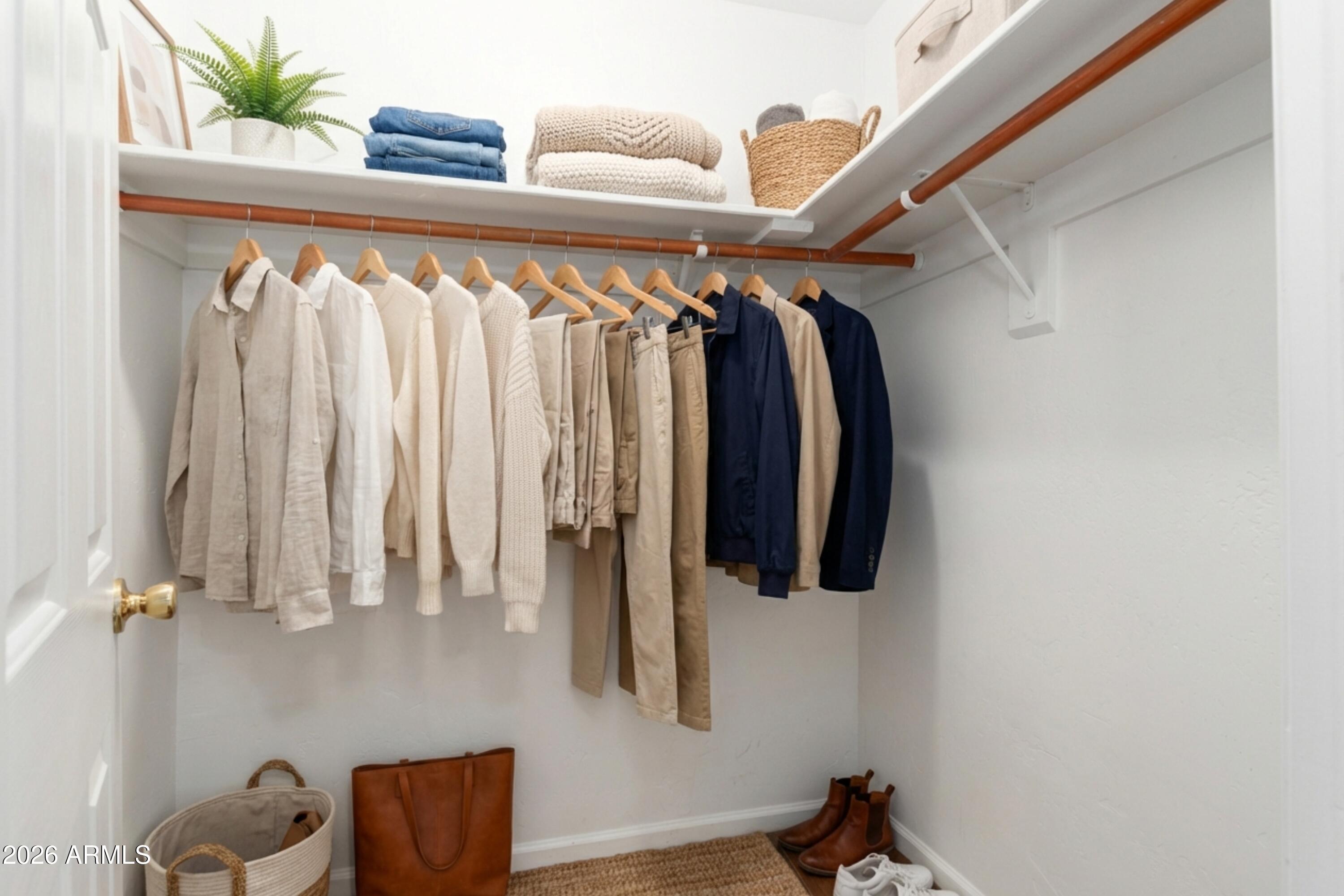 151 East Broadway Road, Unit 103 Tempe, AZ 85282 - Photo 25 of 33 a view of walk in closet with clothes and shoes