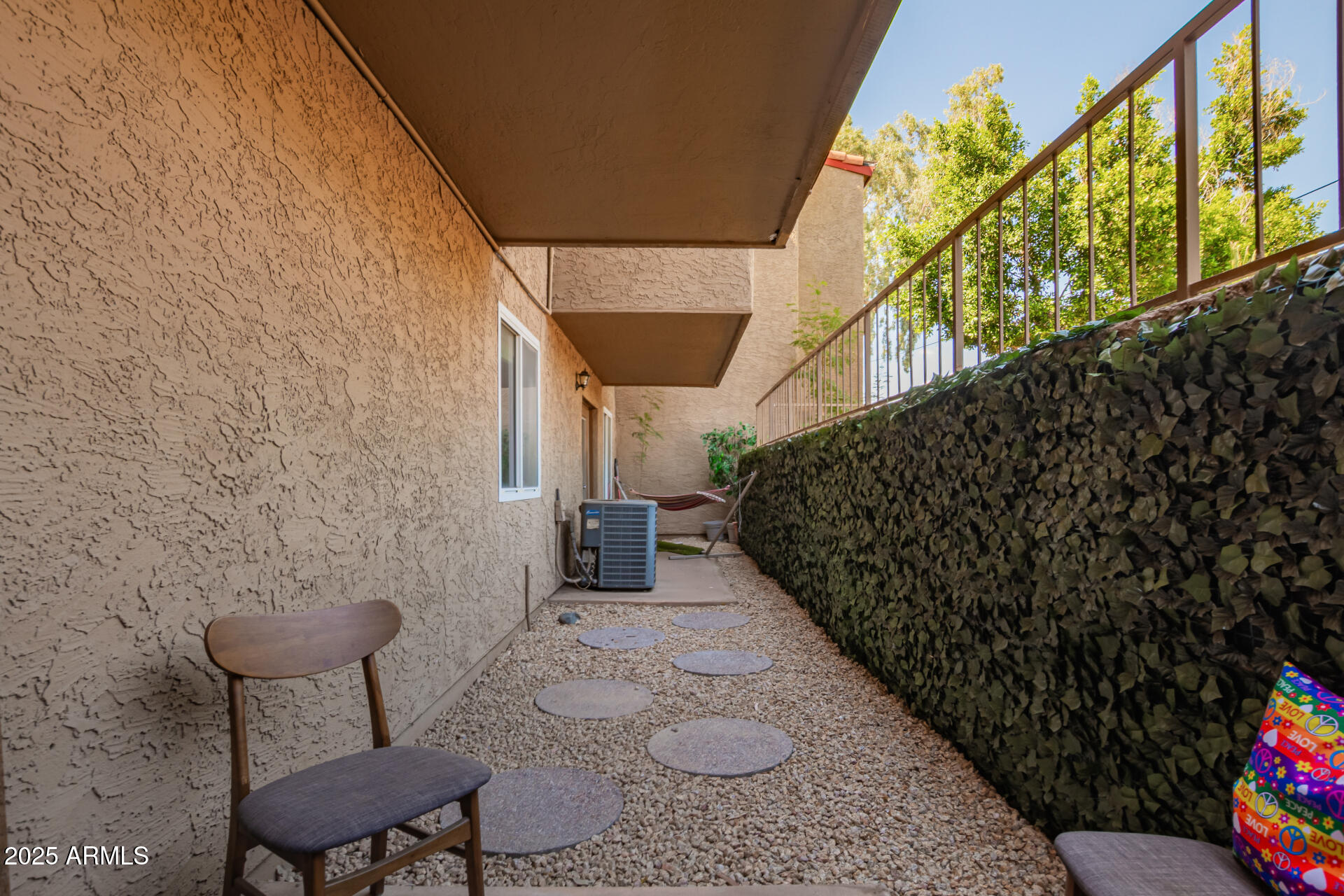 151 East Broadway Road, Unit 103 Tempe, AZ 85282 - Photo 32 of 33 a view of a chairs with an outdoor space