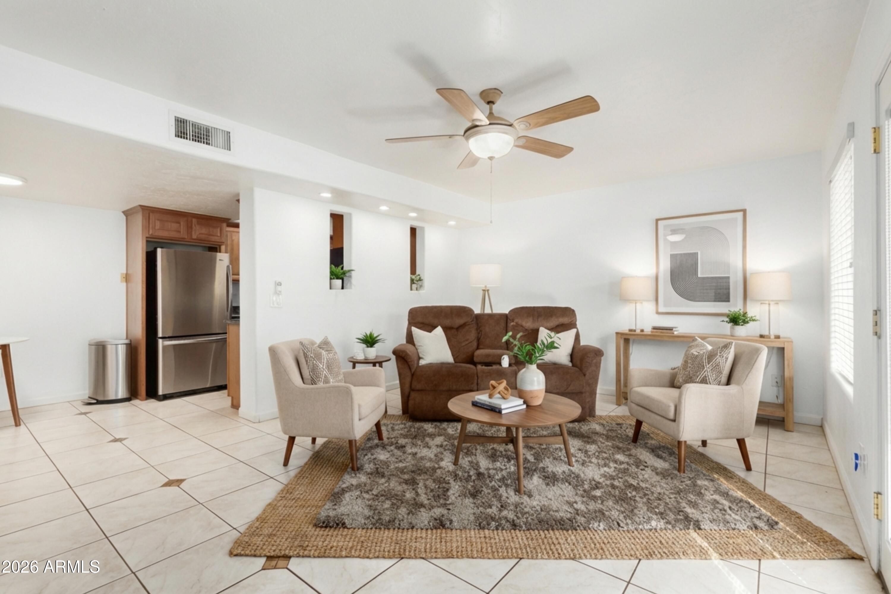151 East Broadway Road, Unit 103 Tempe, AZ 85282 - Photo 5 of 33 a living room with furniture and a rug