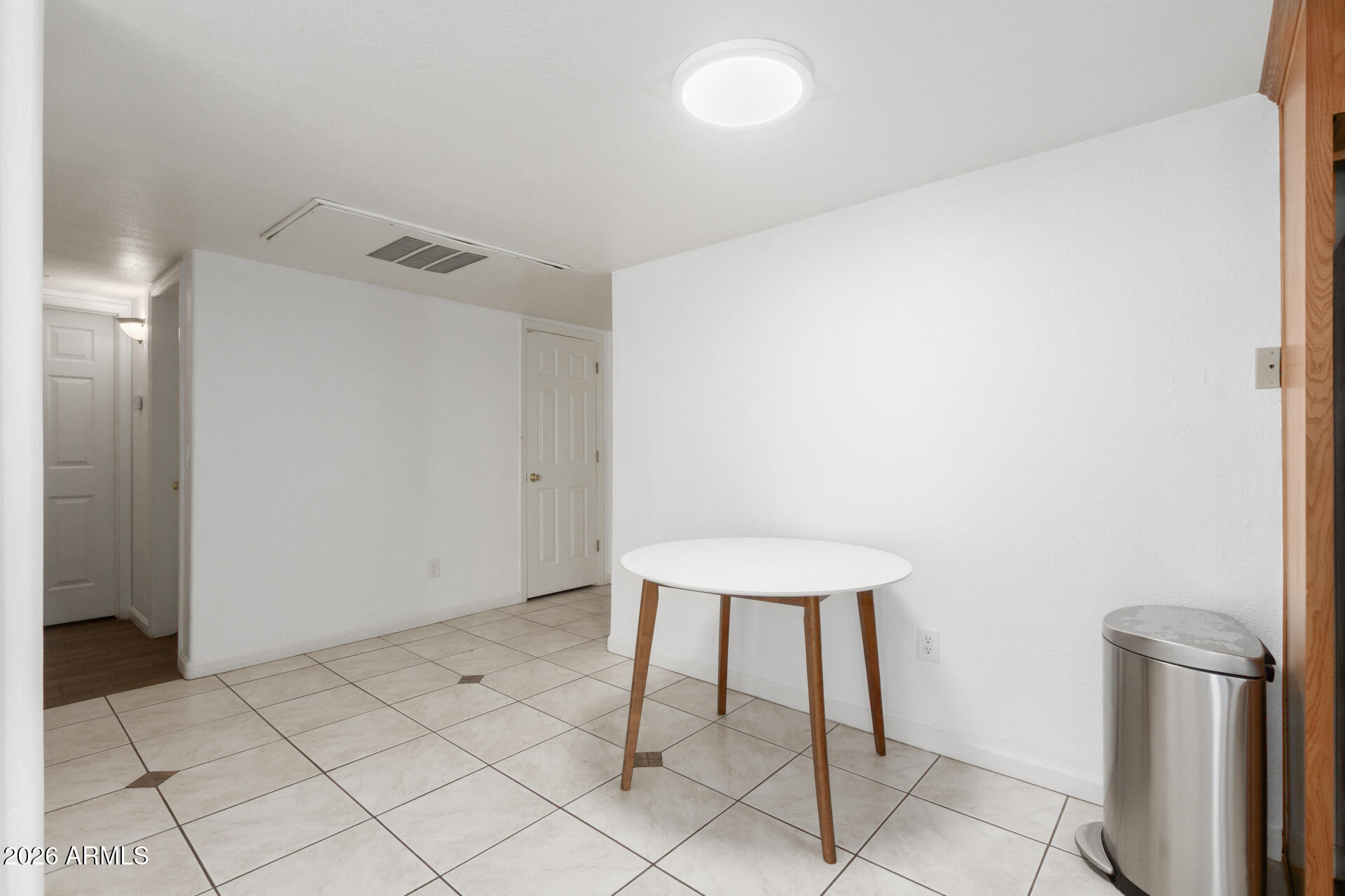 151 East Broadway Road, Unit 103 Tempe, AZ 85282 - Photo 8 of 27 a view of a room with a table and chairs