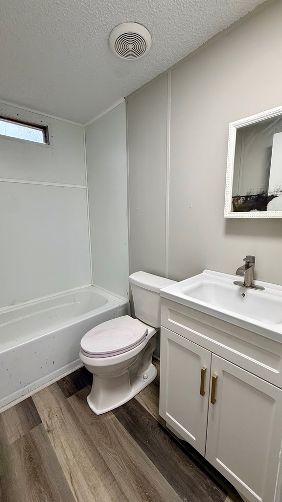 301 Satellite Circle Fortson, GA 31808 - Photo 12 of 24 a bathroom with a toilet a sink and bathtub