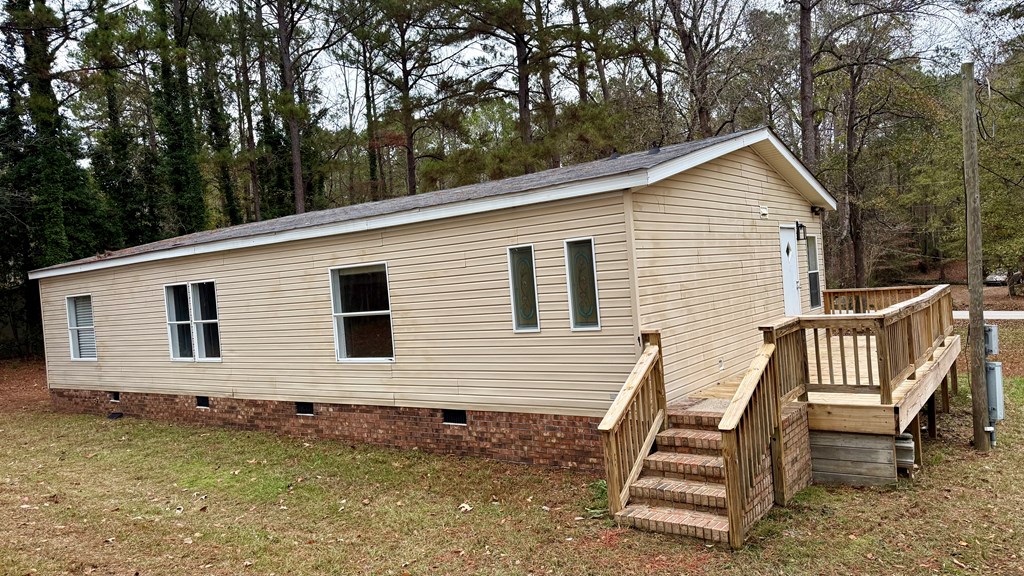 301 Satellite Circle Fortson, GA 31808 - Photo 22 of 24 a view of a house with a yard and deck