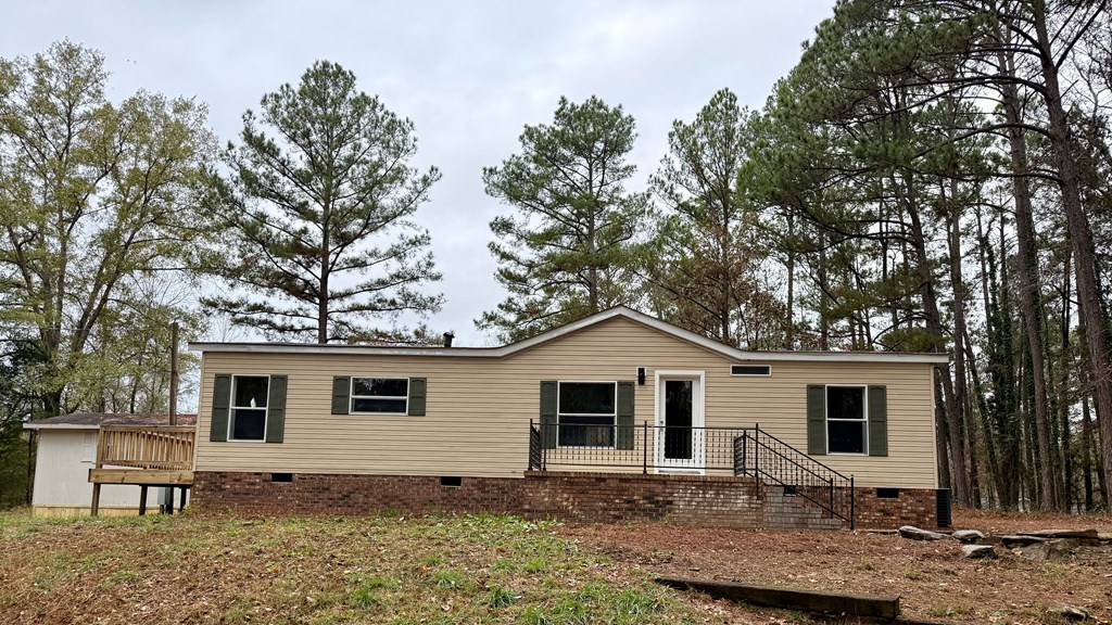 301 Satellite Circle Fortson, GA 31808 - Photo 3 of 24 a view of a yard with a house and a tree
