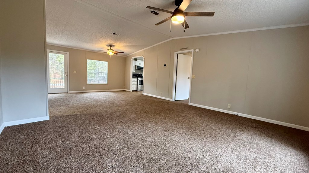 301 Satellite Circle Fortson, GA 31808 - Photo 6 of 24 an empty room with windows and ceiling fan