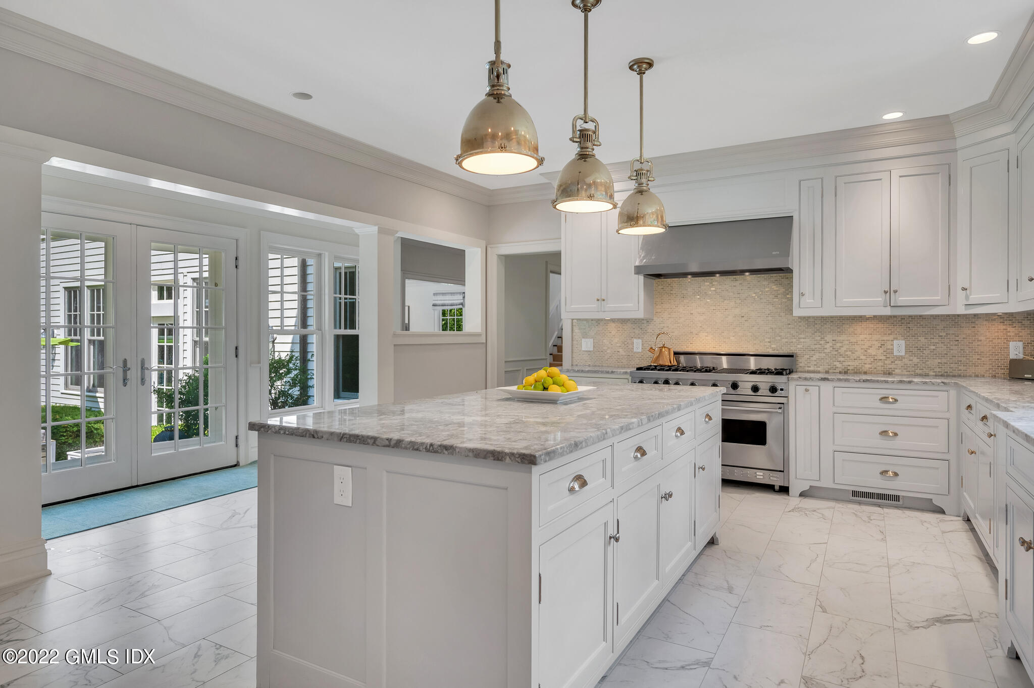174 Cognewaugh Road Cos Cob, CT 06807 - Photo 13 of 37 a kitchen with stainless steel appliances granite countertop a stove oven and a large window