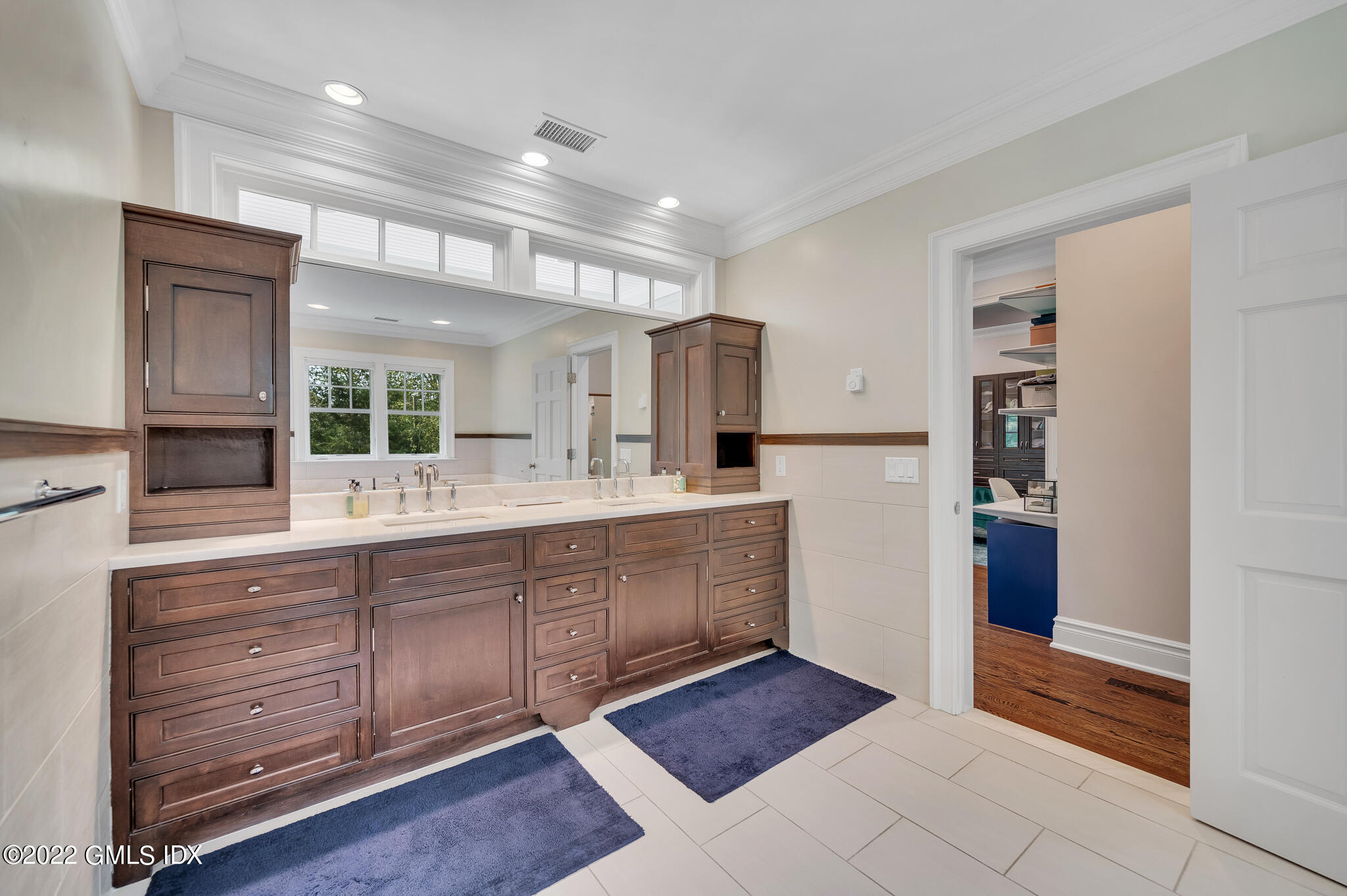 174 Cognewaugh Road Cos Cob, CT 06807 - Photo 19 of 37 a large bathroom with a sink and a mirror